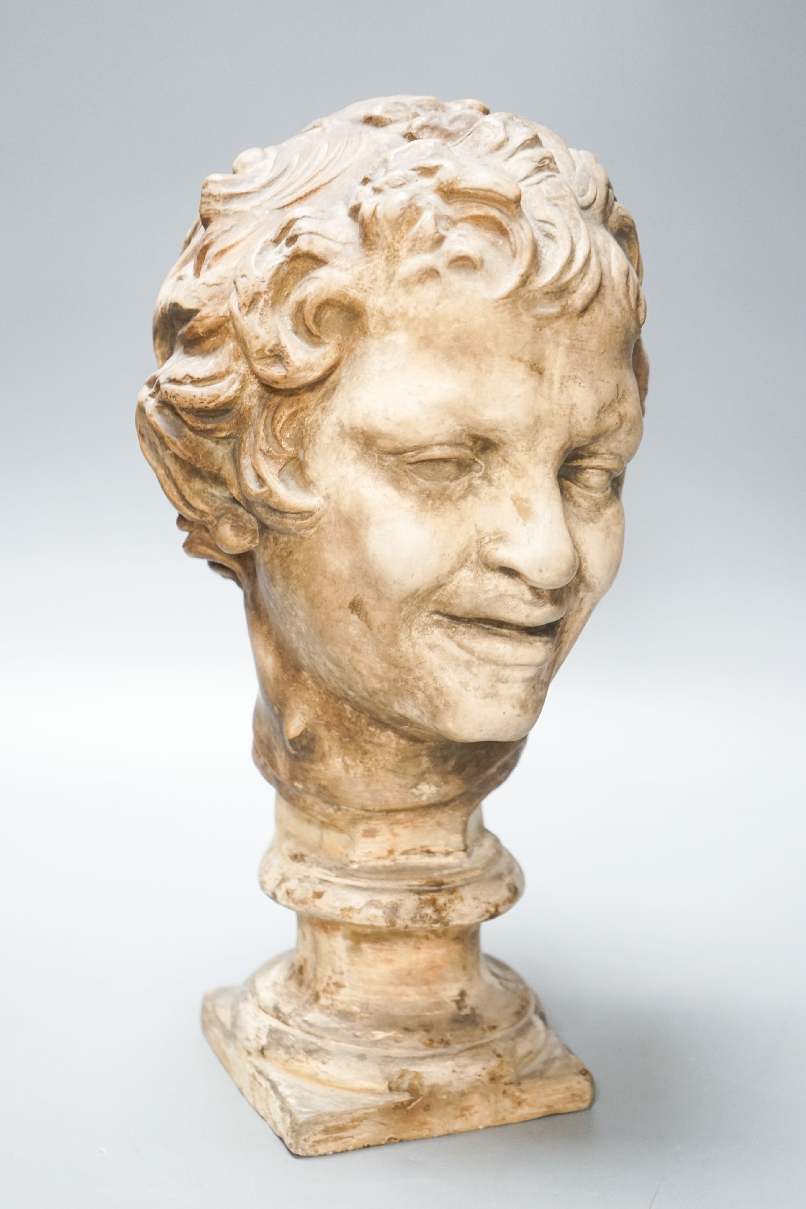 An earthenware bust of a faun, 32cm